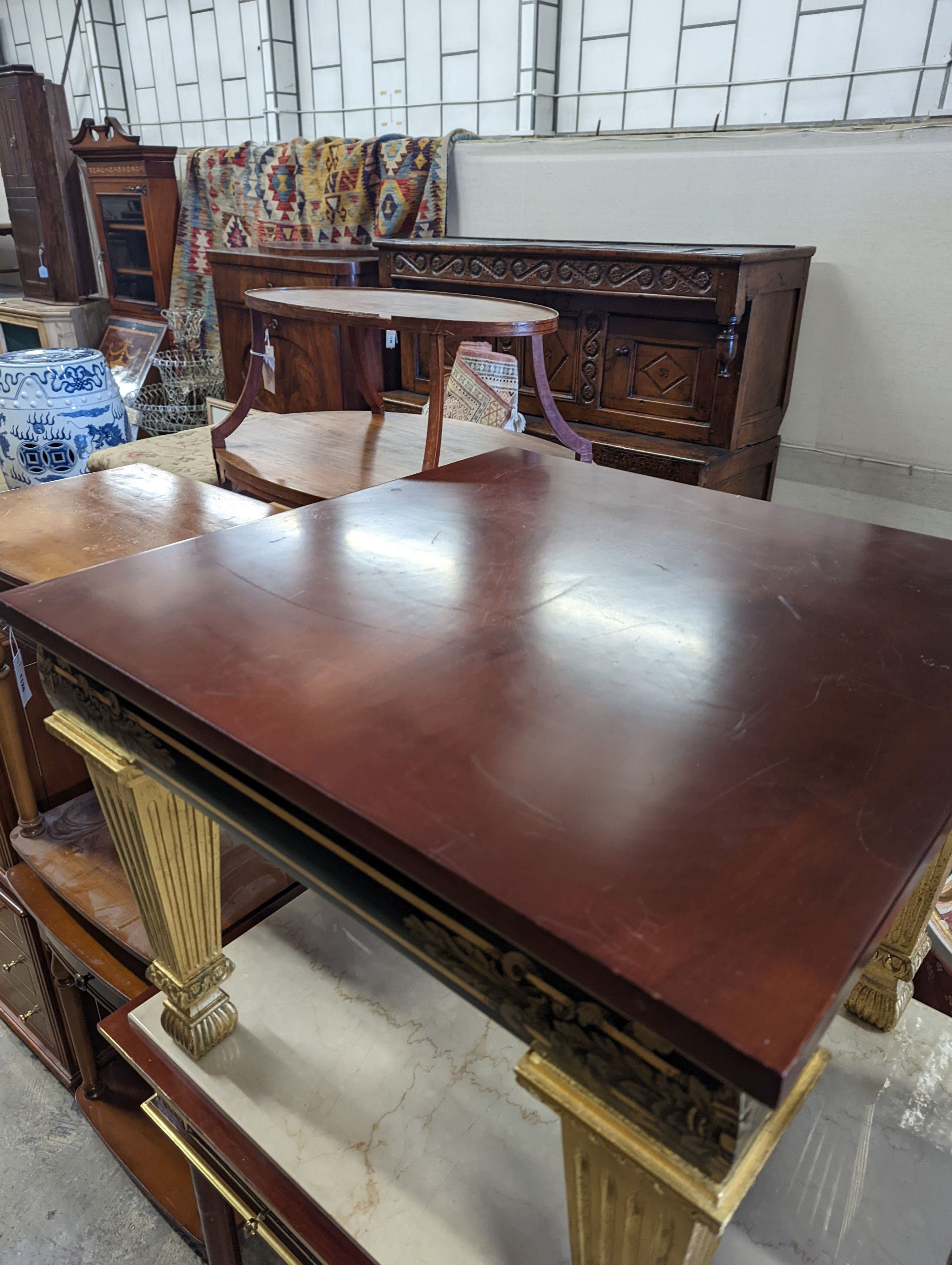 An Empire style parcel gilt mahogany elbow chair together with a similar square low occasional table, width 70cm, height 55cm